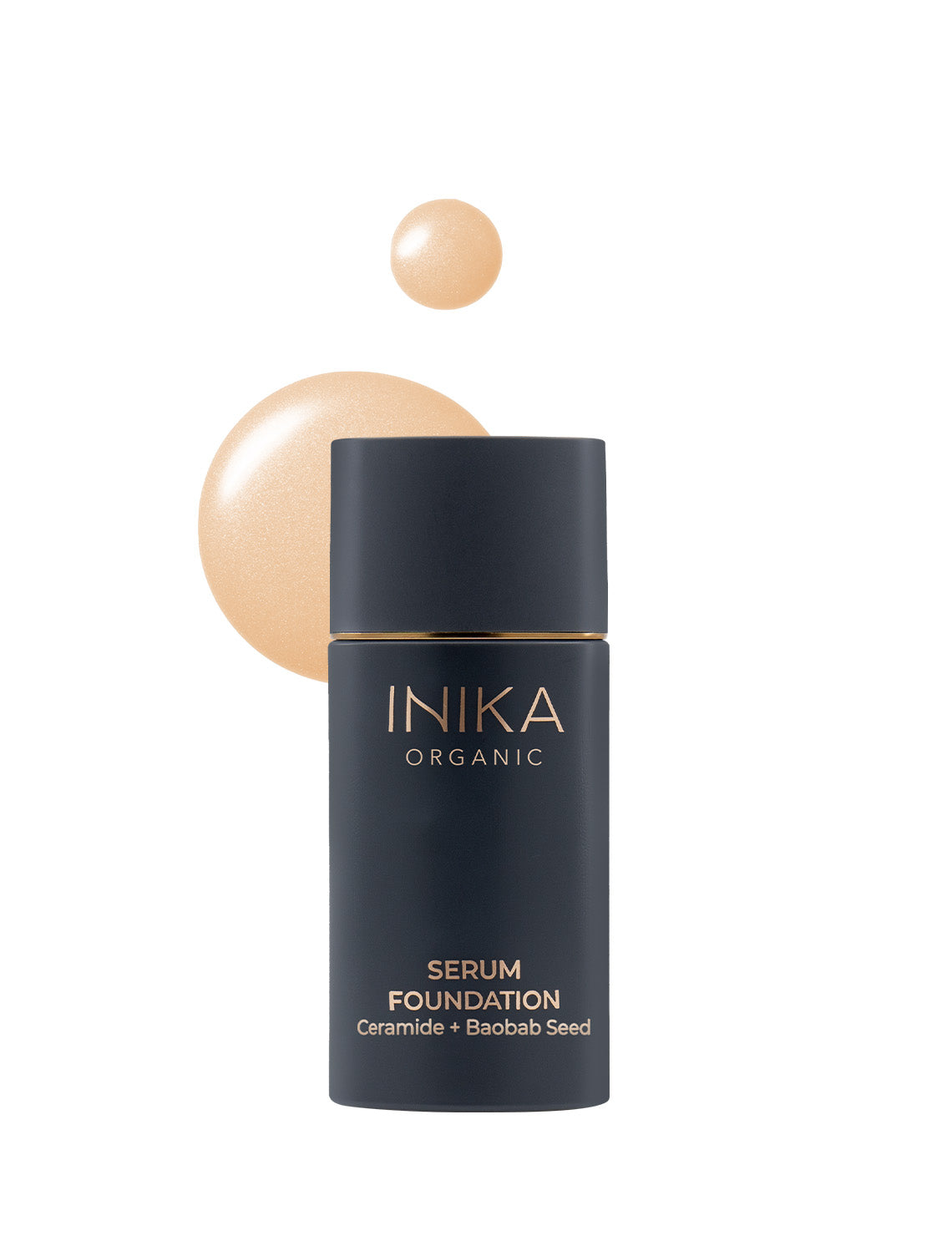 Inika Organic Serum Foundation bottle with beige liquid and droplets, featuring ceramide and baobab seed, on a white background.